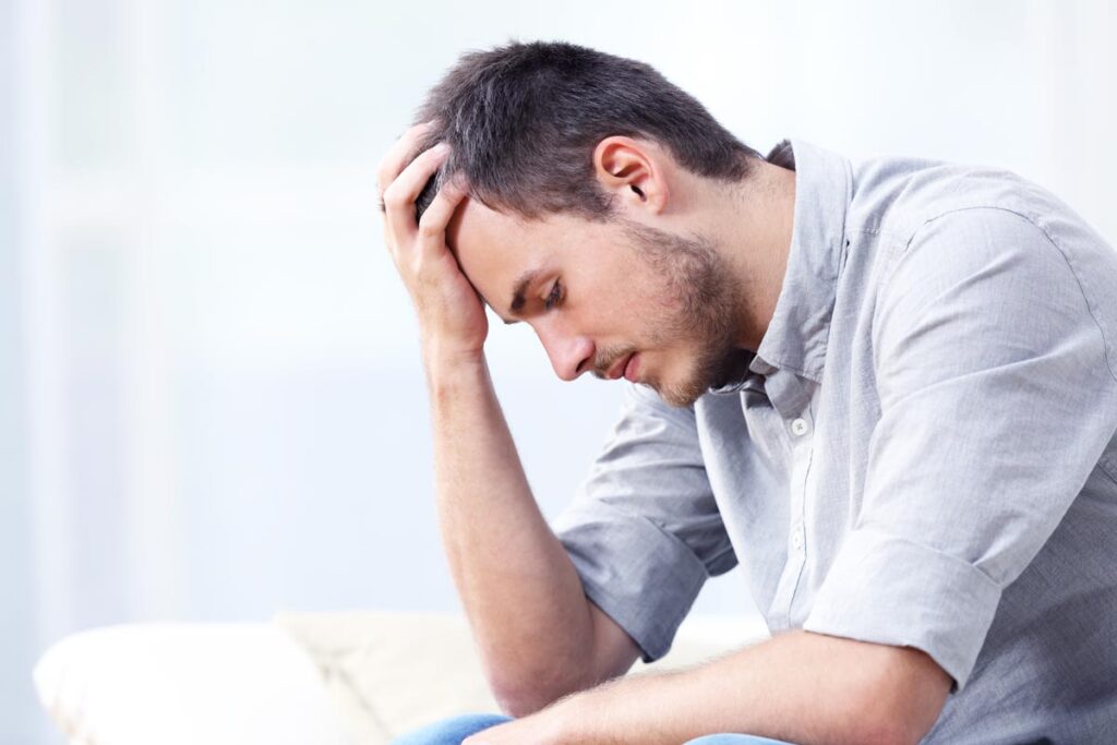 man feeling confused and has fatigue