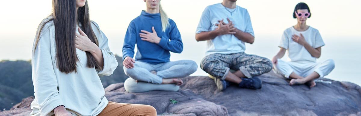 group of people doing meditation