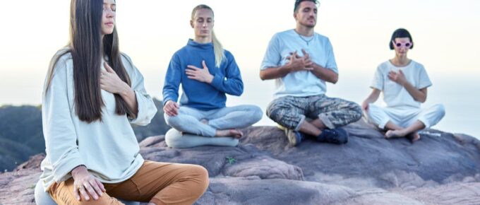 group of people doing meditation